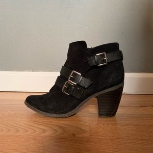 Black heeled buckle boots